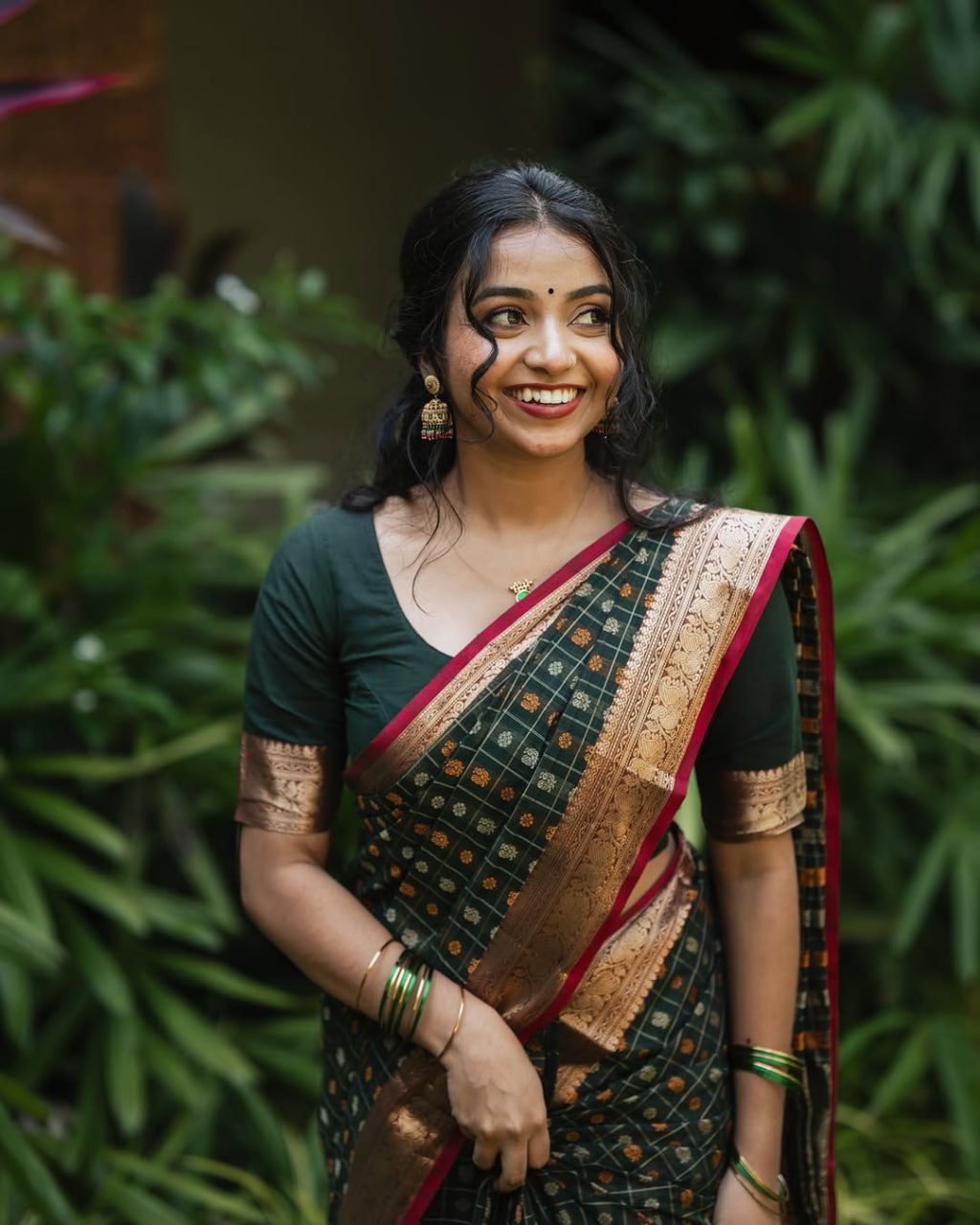 Grean fulljadi adorned with beautiful Zari work in form of traditional motifs.